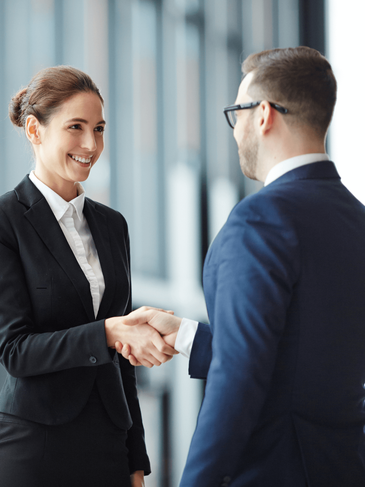 A man and a woman shaking hands after meeting each other a networking event 