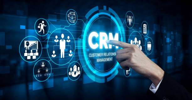 Digital CRM (Customer Relationship Management) dashboard interface with a hand pointing at connected icons