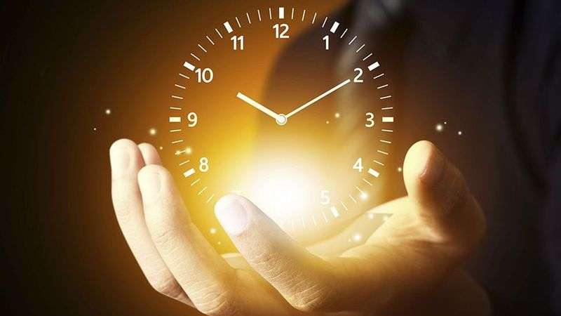Glowing clock face held in cupped hands, representing timing and follow-up in the sales process