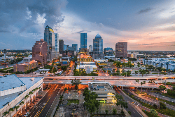 Tampa city skyline and highway at dusk, representing a target market for construction business development
