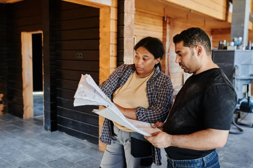 Two contractors reviewing drawings on a commercial jobsite